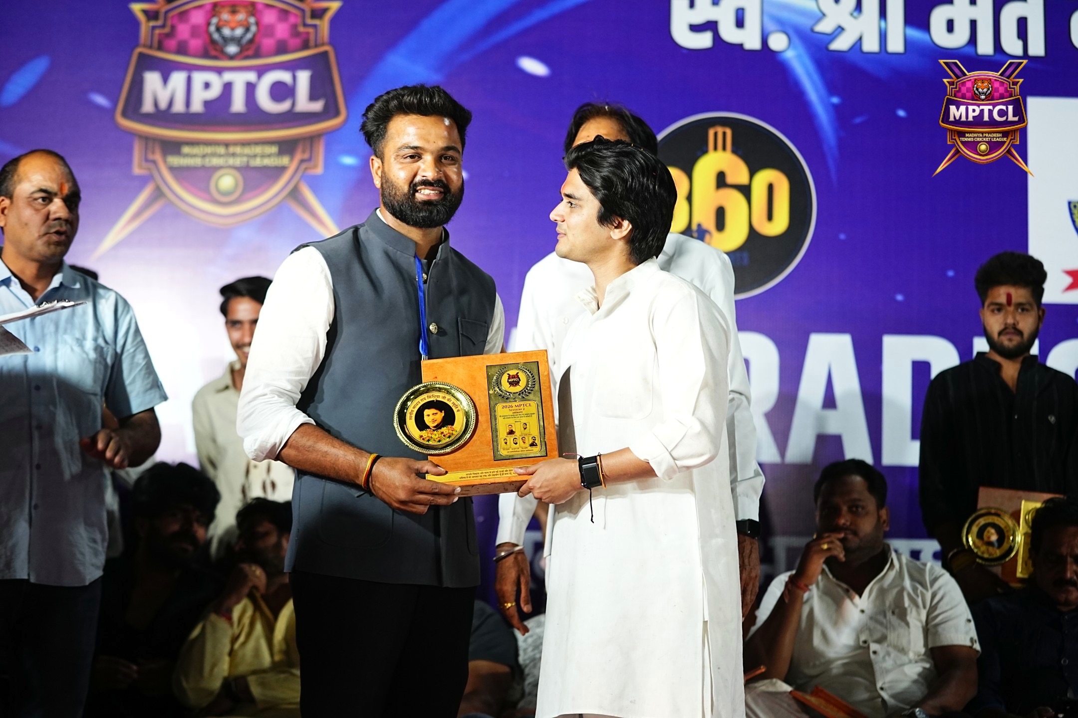 Plaque handover on stage at MPTCL 2025